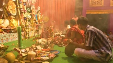 Howrah, India - October 15th, 2021 : Sandhi Puja, the sacred juncture of Ashtami, eighth day and Nabami, nineth day, as Hindu ritual for praying to Goddess Durga. Durga puja festival.