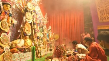 Howrah, India - October 15th, 2021 : Sandhi Puja, the sacred juncture of Ashtami, eighth day and Nabami, nineth day, as Hindu ritual for praying to Goddess Durga. Durga puja festival.