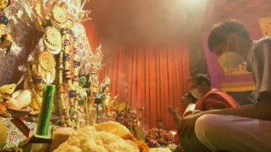 Howrah, India - October 15th, 2021 : Sandhi Puja, the sacred juncture of Ashtami, eighth day and Nabami, nineth day, as Hindu ritual for praying to Goddess Durga. Durga puja festival.