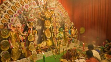 Howrah, India - October 15th, 2021 : Sandhi Puja, the sacred juncture of Ashtami, eighth day and Nabami, nineth day, as Hindu ritual for praying to Goddess Durga. Durga puja festival.