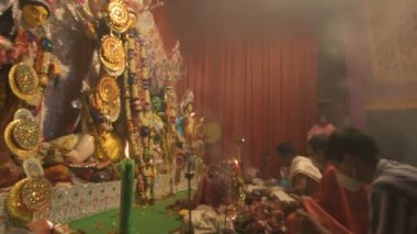 Howrah, India - October 15th, 2021 : Sandhi Puja, the sacred juncture of Ashtami, eighth day and Nabami, nineth day, as Hindu ritual for praying to Goddess Durga. Durga puja festival.