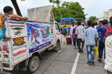 Kolkata, West Bengal, India - 21st July 2022 : All India Trinamool Congress Party, AITC or TMC, at Ekushe July, Shadid Dibas, Martyrs day rally. Party supporters arriving on vans with party flags.