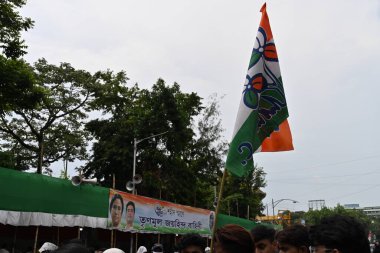 Kolkata, West Bengal, India - 21st July 2022 : All India Trinamool Congress Party, AITC or TMC, at Ekushe July, Shadid Dibas, Martyrs day rally. Colourful party flags waving over heads.
