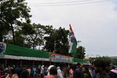 Kolkata, West Bengal, India - 21st July 2022 : All India Trinamool Congress Party, AITC or TMC, at Ekushe July, Shadid Dibas, Martyrs day rally. Colourful party flags waving over heads.