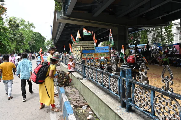 Kolkata, West Bengal, India - 21st July 2022 : All India Trinamool Congress Party, AITC or TMC, at Ekushe July, Shadid Dibas, Martyrs day rally. Party supporter arriving with family and kid.