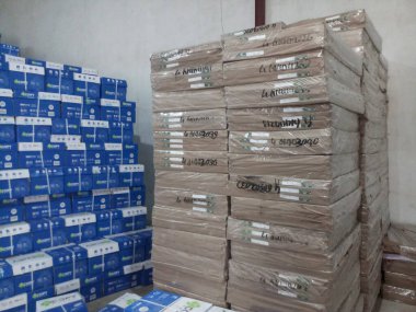 Raipur, Chattisgarh, India - 9th August 2019 : Maplitho and Copier Paper reams are stacked up inside a paper godown.