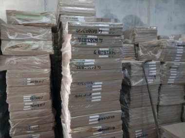 Raipur, Chattisgarh, India - 9th August 2019 : Maplitho and Copier Paper reams are stacked up inside a paper godown.