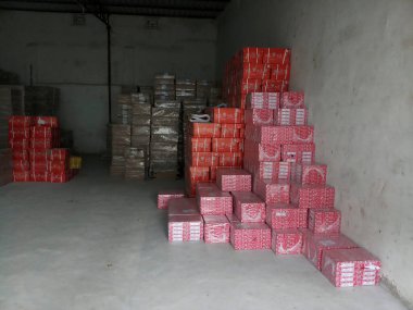 Raipur, Chattisgarh, India - 9th August 2019 : Maplitho and Copier Paper reams are stacked up inside a paper godown.