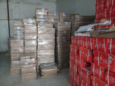 Raipur, Chattisgarh, India - 9th August 2019 : Maplitho and Copier Paper reams are stacked up inside a paper godown.