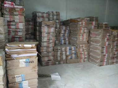 Raipur, Chattisgarh, India - 9th August 2019 : Maplitho and Copier Paper reams are stacked up inside a paper godown.