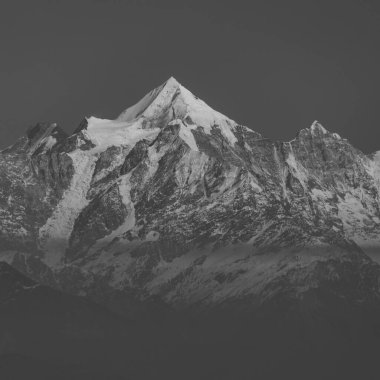A Close up view of Nanda Devi peak and glacier in the Kumaun Himalayan range in monochrome clipart