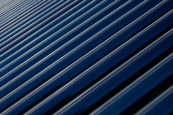 View of Solar panel tubes in a line as abstract patterns and background