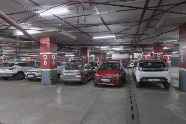 Many cars parked in a row in a basement parking in a shopping mall at Pune India on 15 December 2022