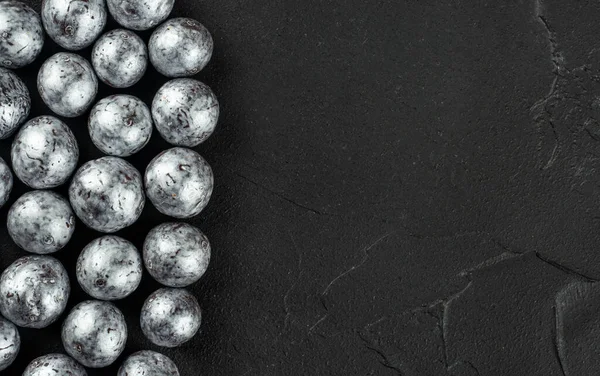 Silver Candies Hazelnuts Chocolate Scattered Concrete Dark Background Copy Space — 스톡 사진