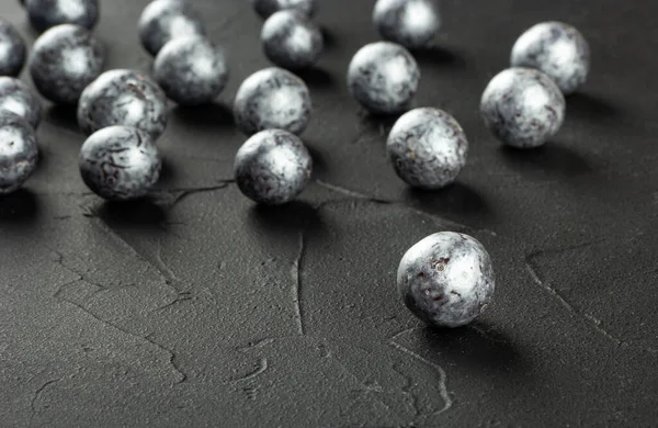Silver Candies Hazelnuts Chocolate Scattered Concrete Dark Background — Φωτογραφία Αρχείου
