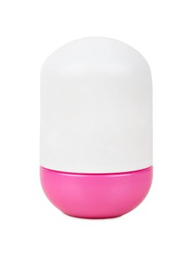 Closed light plastic deodorant jar with pink lid isolated on white background.