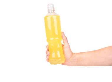 Plastic bottle with isotonic drink with lemon flavor in male hand isolated on white background. 