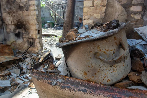 saucepan in a destroyed house after a Russian shell hit a private house in Irpin, Ukraine. War crimes concept.