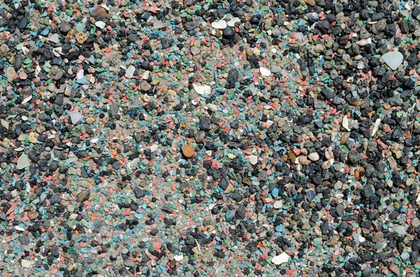 Sahildeki deniz renkli çakıl taşlarının arka planı