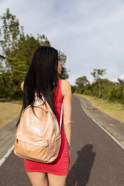 Young Girl Black Hair Walking Asphalt Road Wearing Red Casual — Stock Fotó