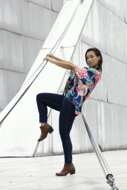 resting young model lifestyle, latin woman with short black hair, wear casual clothes