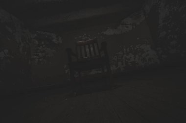 Eski sandalye, ahşap zeminli karanlık ve boş bir odada oturuyor.