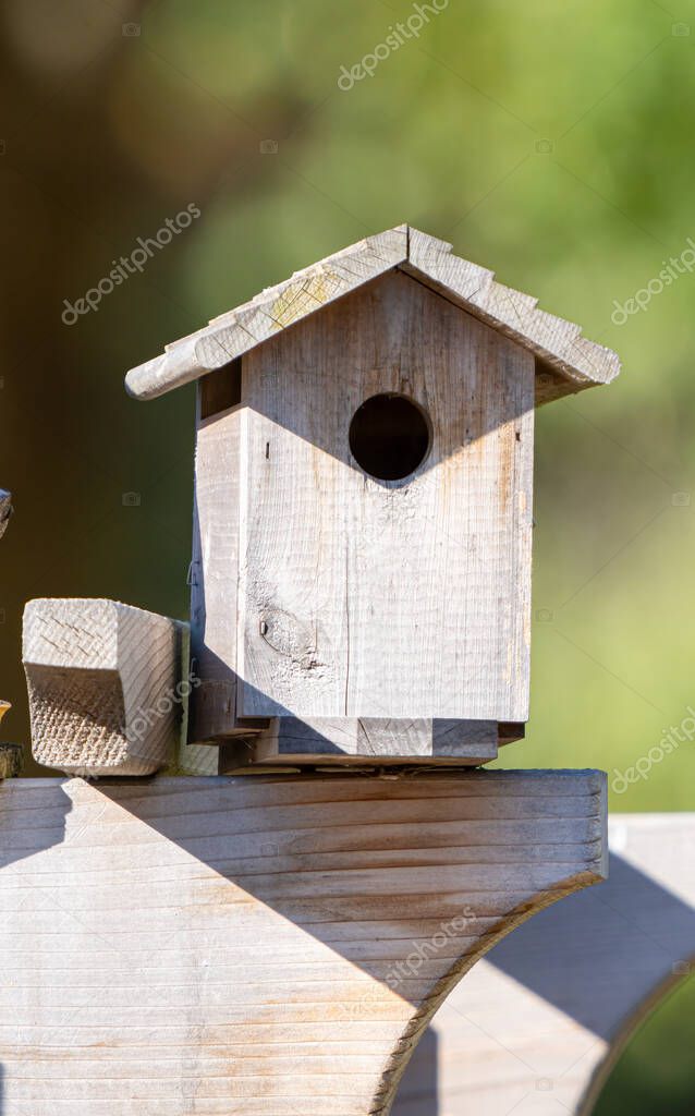 bird house mounted in the garden is waiting for new visitors