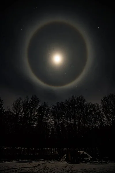Halo around the Moon in the night sky, Ukraine 12.03.2022
