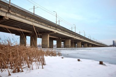 View of the North Bridge in Voronezh through a frozen reservoir