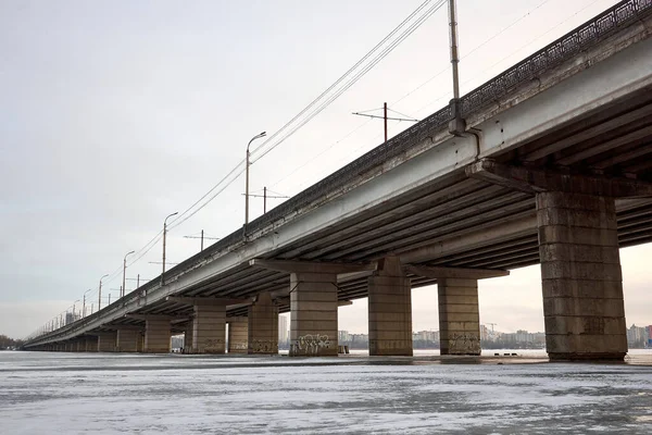 View of the North Bridge in Voronezh through a frozen reservoir