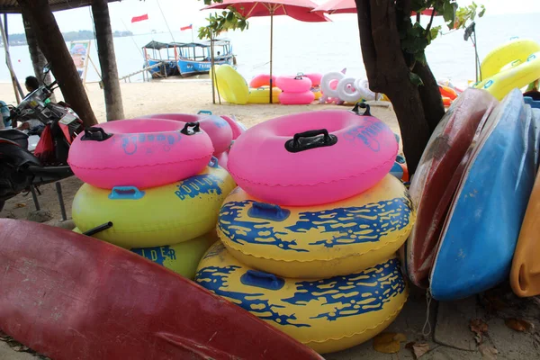 Swim ring with various colors and shapes for rent on the beach