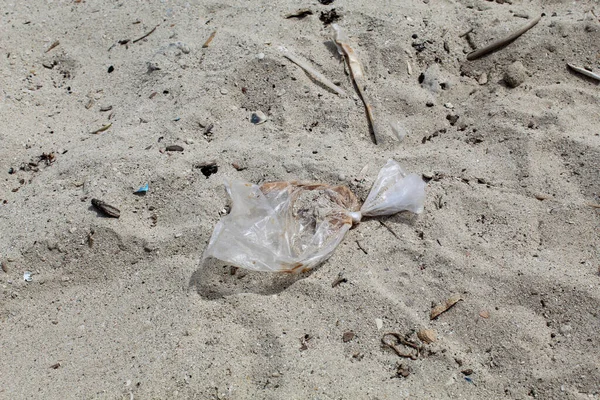 Plastic trash on the sand beach