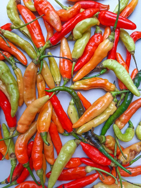 Bird\'s eye, bird eye chili, bird\'s chili or Thai chili, or chili pepper. Close up detail. Various color.