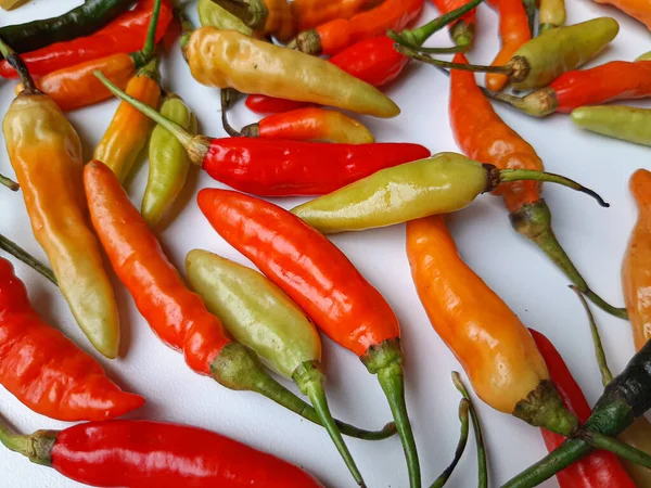 Bird\'s eye, bird eye chili, bird\'s chili or Thai chili, or chili pepper. Close up detail. Various color.