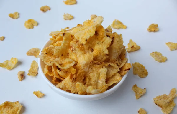 Marning is a snack made from mashed corn, then fried. Savory taste. Well known from Central Java, Indonesia. Isolated on white background. Top view