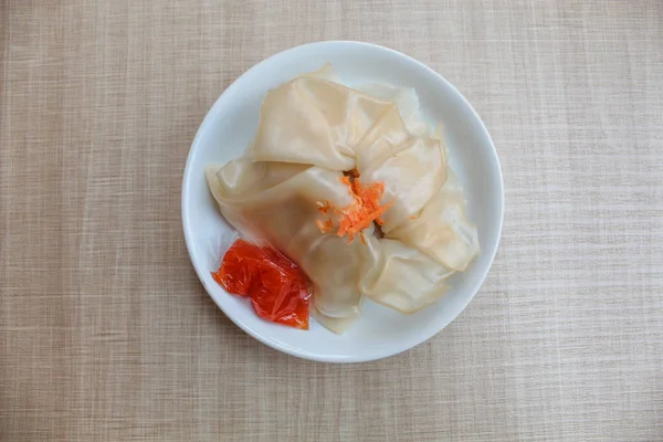 Affordable version of dumplings, with a small packet of sauce