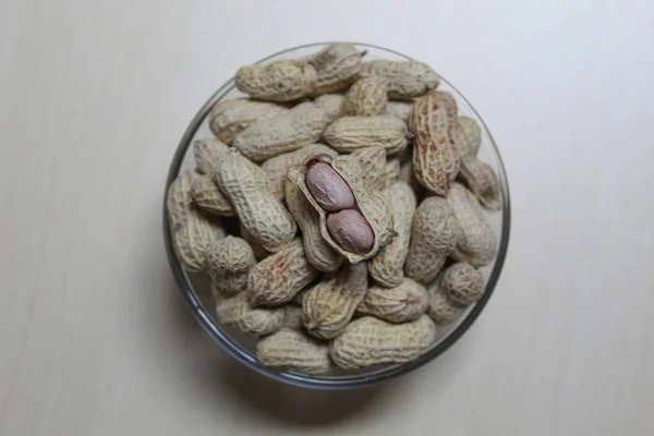 Roasted peanut on a transparent bowl