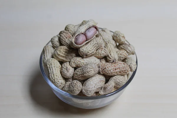 Roasted peanut on a transparent bowl