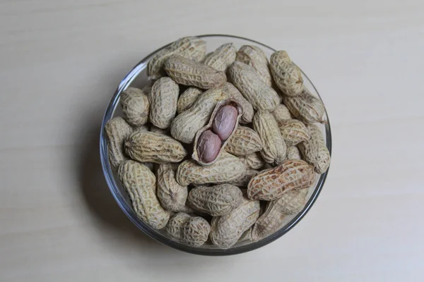 Roasted peanut on a transparent bowl