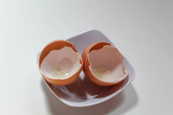 Chicken egg shell, on a white plate
