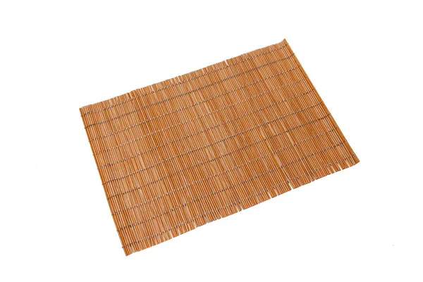 Bamboo rug for making sushi on a white isolated background. Kitchenware. — Stock Photo, Image