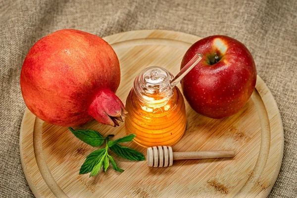 Rosh Hashanah. Pomegranate, apple and honey, traditional food for Jewish New Year celebration, Rosh Hashanah. View from above. Holidays.