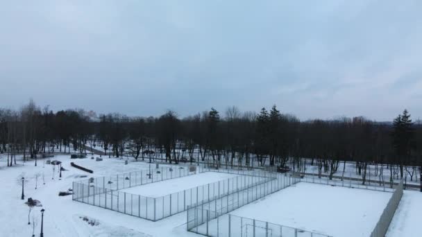 Flying Sports Field Snow Covered City Park Aerial Photography — стоковое видео