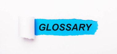 Parlak mavi arkaplanda, yırtık çizgili beyaz kağıt ve GLOSSARY metni