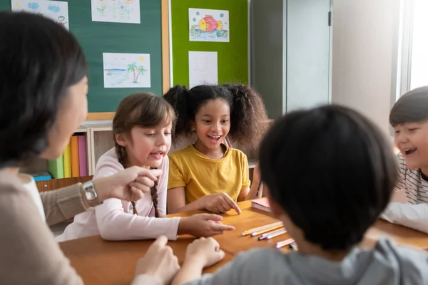 Pupils Playing Games Asian Female Teacher Together Classroom Group Diverse — 스톡 사진
