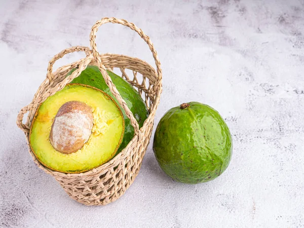 Organic Avocado Seed Avocado Halves Basket Whole Fruits Gray Stone — Stock Photo, Image
