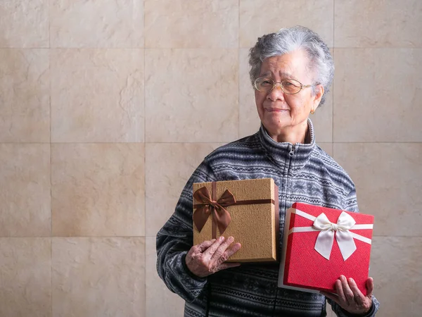 Portrait Senior Woman Hug Gift Boxes Smiling Looking Camera While — Foto de Stock