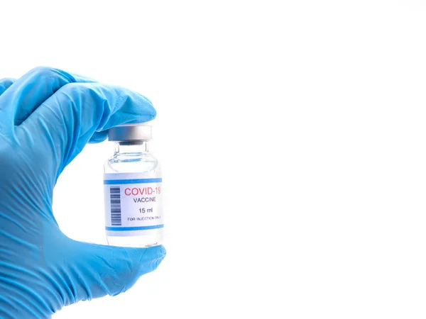 Mão Usando Luva Sanitária Azul Segurando Uma Vacina Covid Frasco — Fotografia de Stock