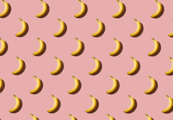 Texture of bananas on a pink background, banana pattern