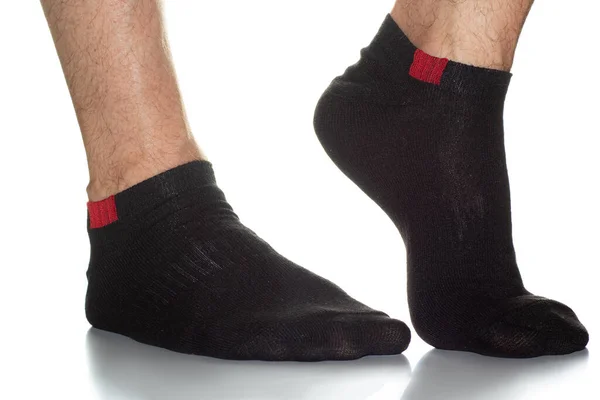 Ayaklarında Kırmızı Bir Eklem Olan Siyah Erkek Çorapları Beyaz Arka — Stok fotoğraf
